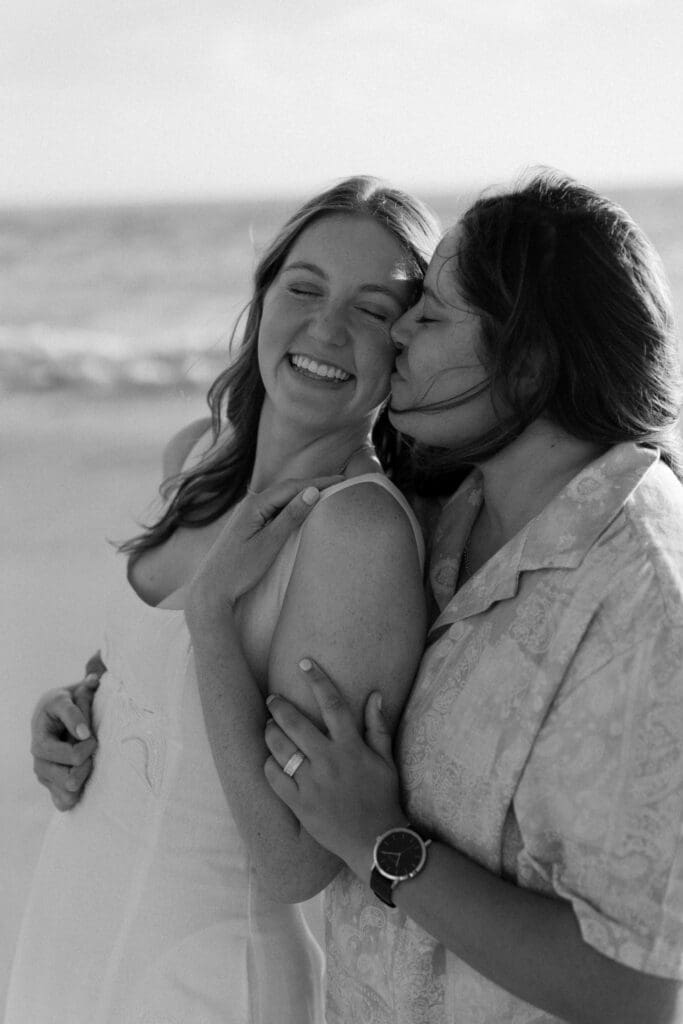 Genuine reactions after a surprise proposal on the beach