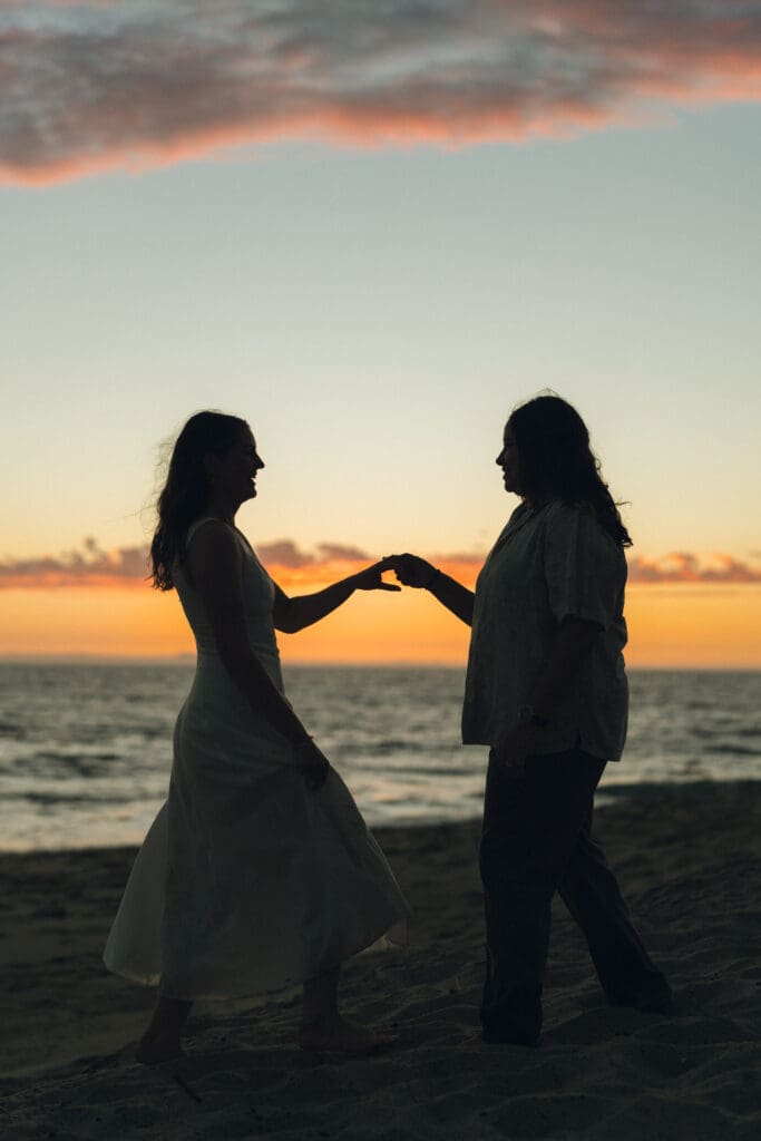 Warm golden light during beach proposal photography session in Southern California