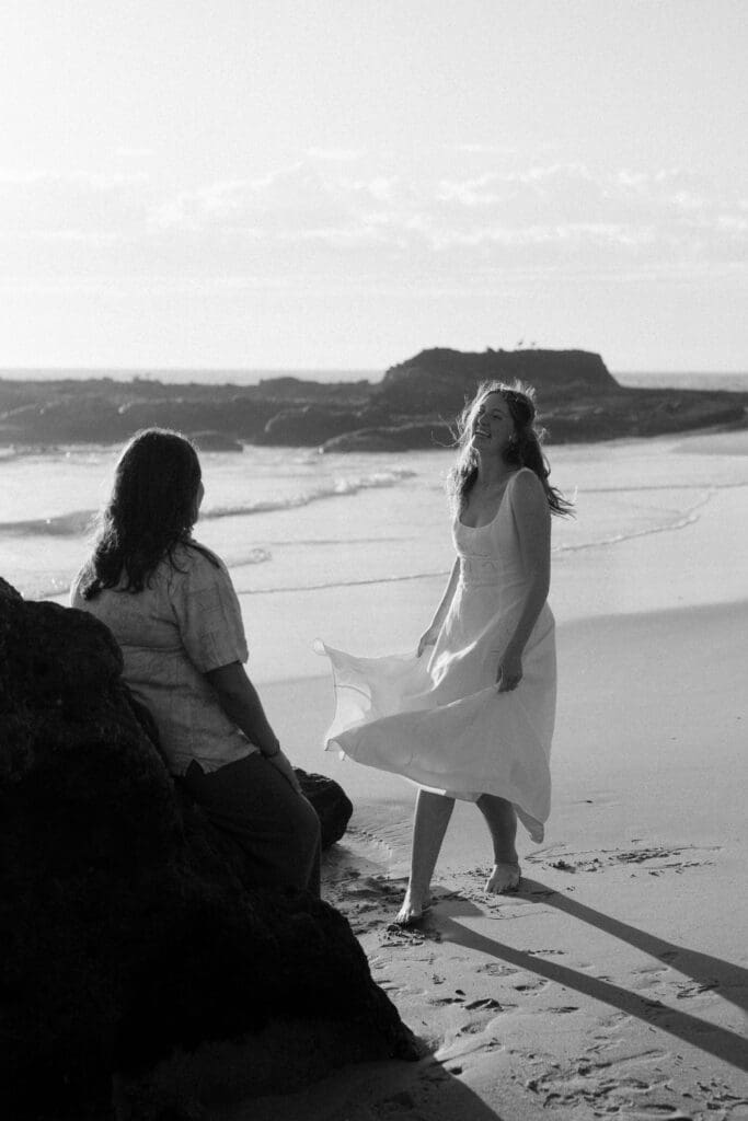 Couple laughing during candid couples photoshoot