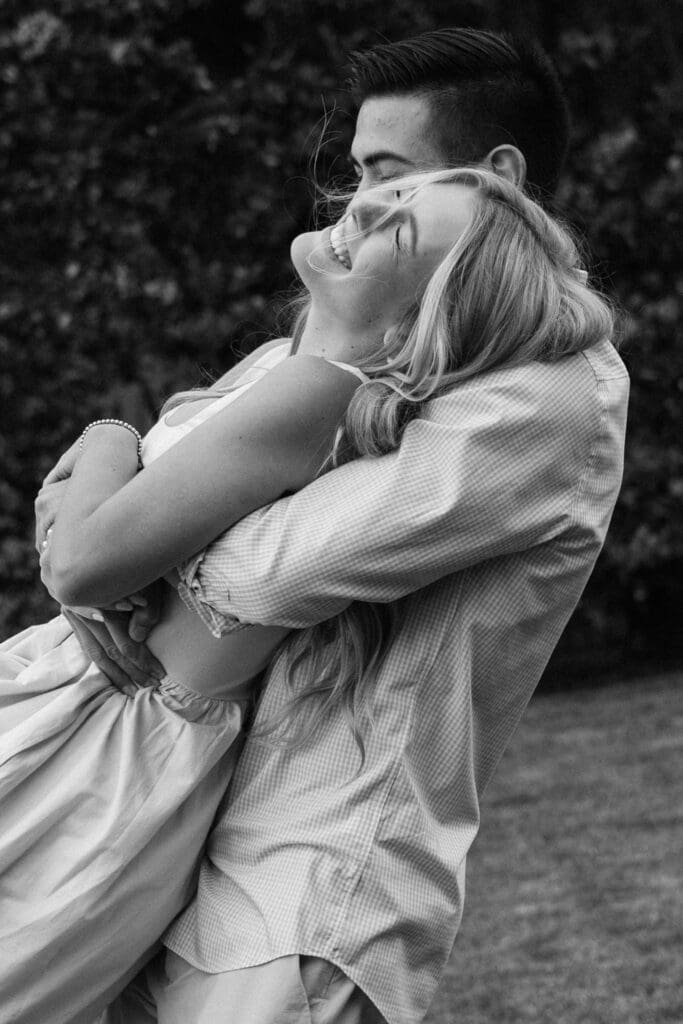 candid couples photo ideas: couple about to kiss while running